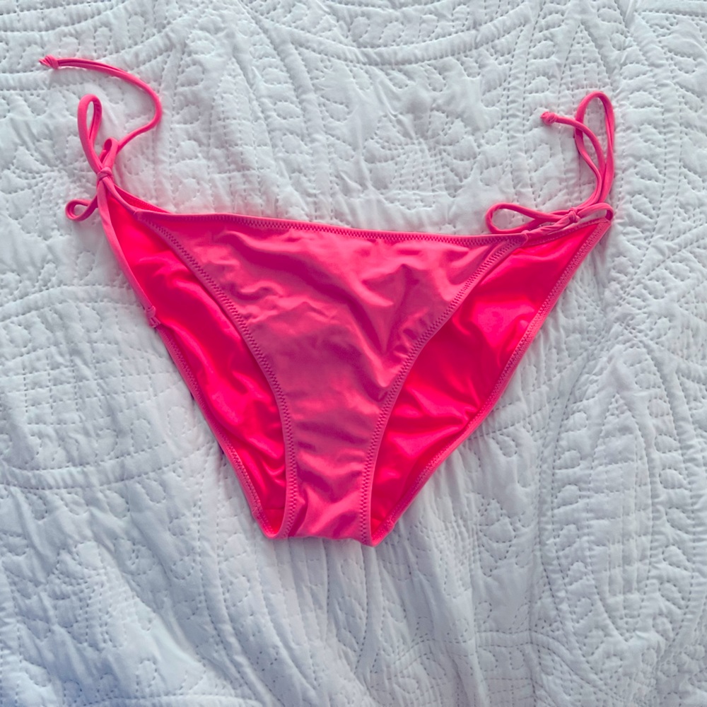 Neon pink bikini bottom with tie sides and ruched back seam